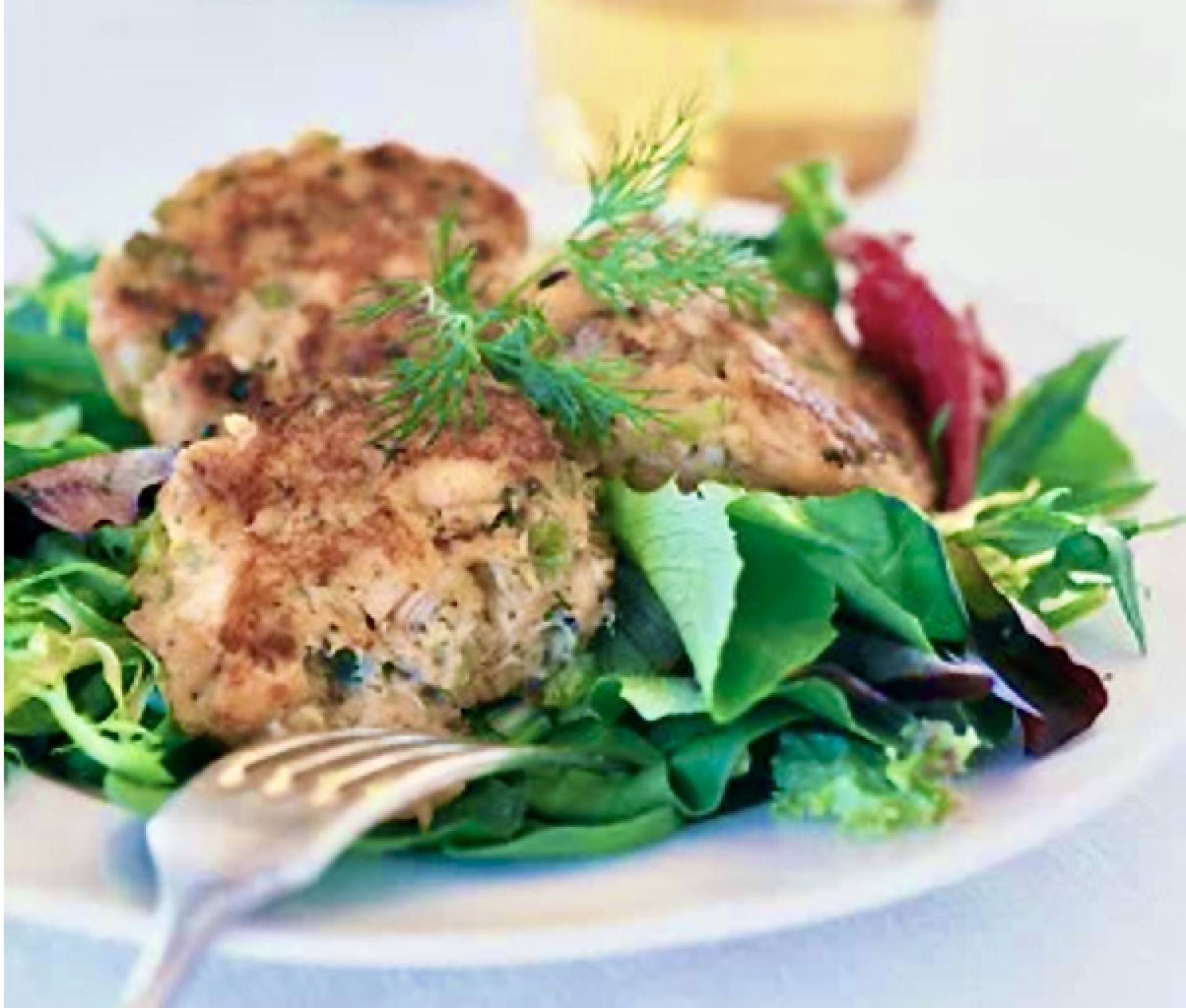 Salmon Cakes over Spring Mix Salad